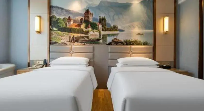 Bed in Vienna Hotel Wuhan Guobo Jiangang Metro Station Bed in Vienna Hotel Wuhan Guobo Jiangang Metro Station