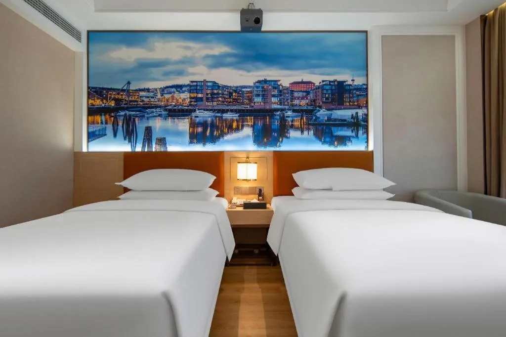 Bed in Vienna Hotel Wuhan Guobo Jiangang Metro Station