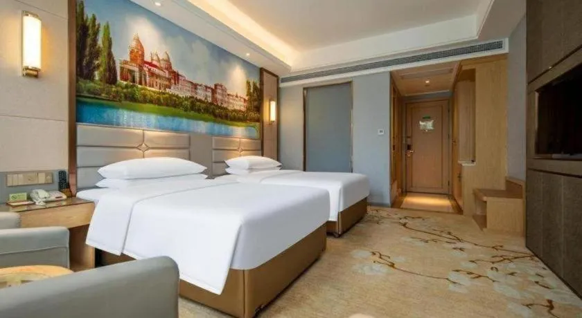Bed in Vienna Hotel Wuhan Guobo Jiangang Metro Station