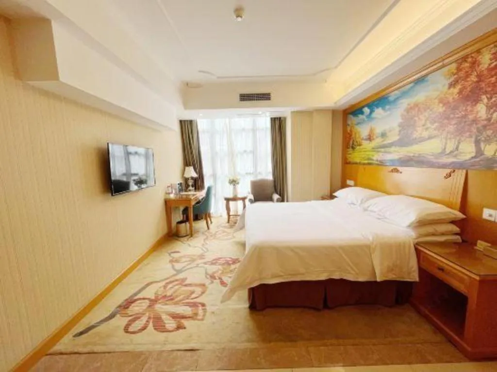 Bed in Vienna Hotel Chongqing Wanzhou Wanda Plaza