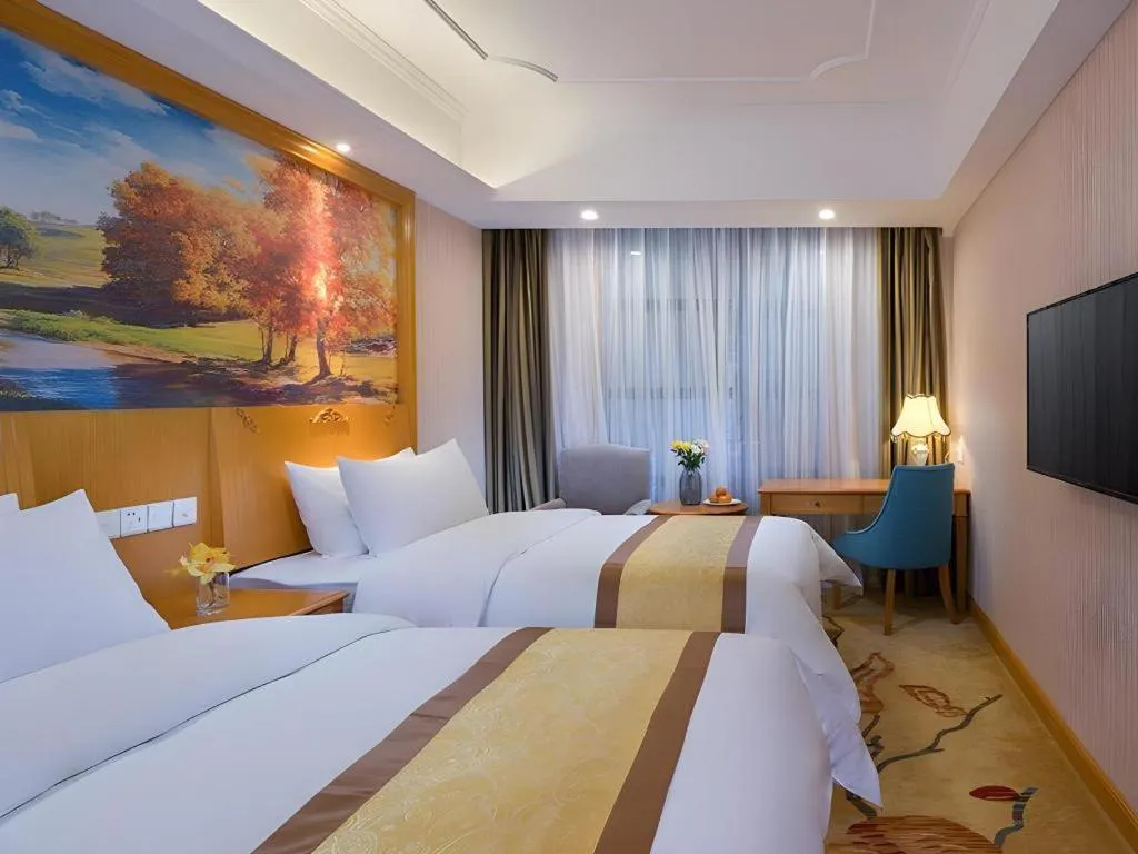 Bed in Vienna Hotel Chongqing Wanzhou Wanda Plaza