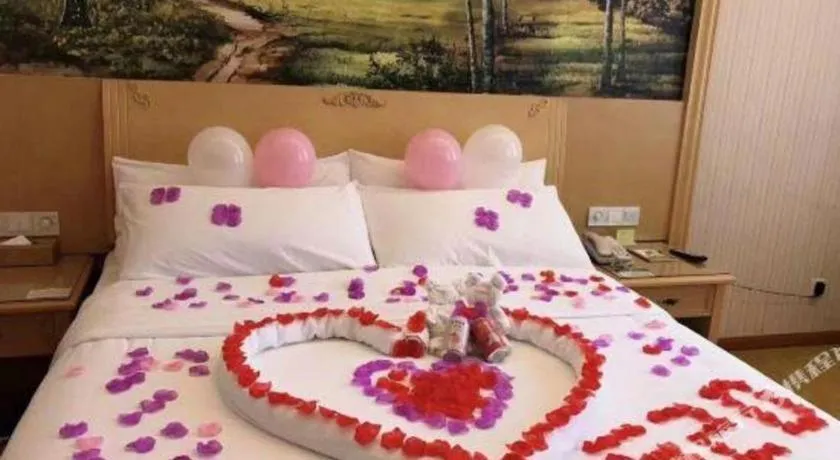 Bed in Vienna Hotel Chongqing Wanzhou Wanda Plaza