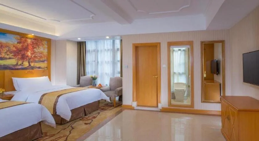 Bed in Vienna Hotel Chongqing Wanzhou Wanda Plaza