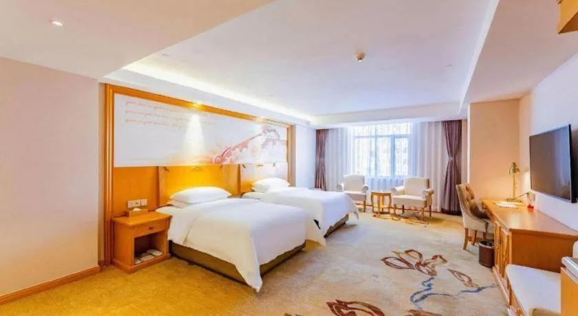 Bed in Vienna Hotel Jilin Dunhua High-Speed Railway Station