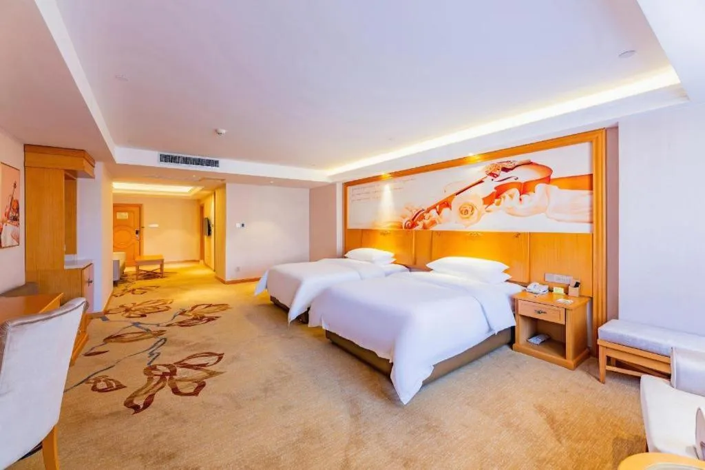 Bed in Vienna Hotel Jilin Dunhua High-Speed Railway Station