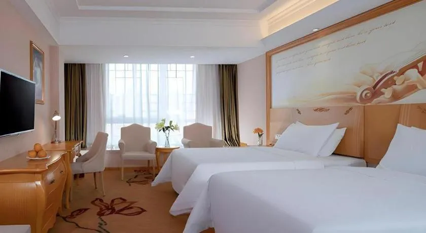 Bed in Vienna Hotel Guangxi Guilin Gongchengtianjie