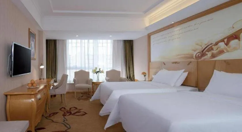 Bed in Vienna Hotel Guangxi Guilin Gongchengtianjie