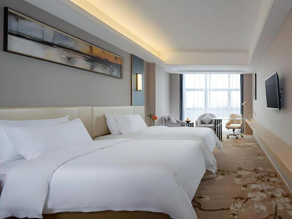 Bed in Vienna Hotel Guangdong Zhongshan Xiaolan High-Speed Railway Station