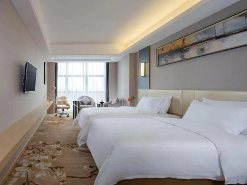 Bed in Vienna Hotel Guangdong Zhongshan Xiaolan High-Speed Railway Station