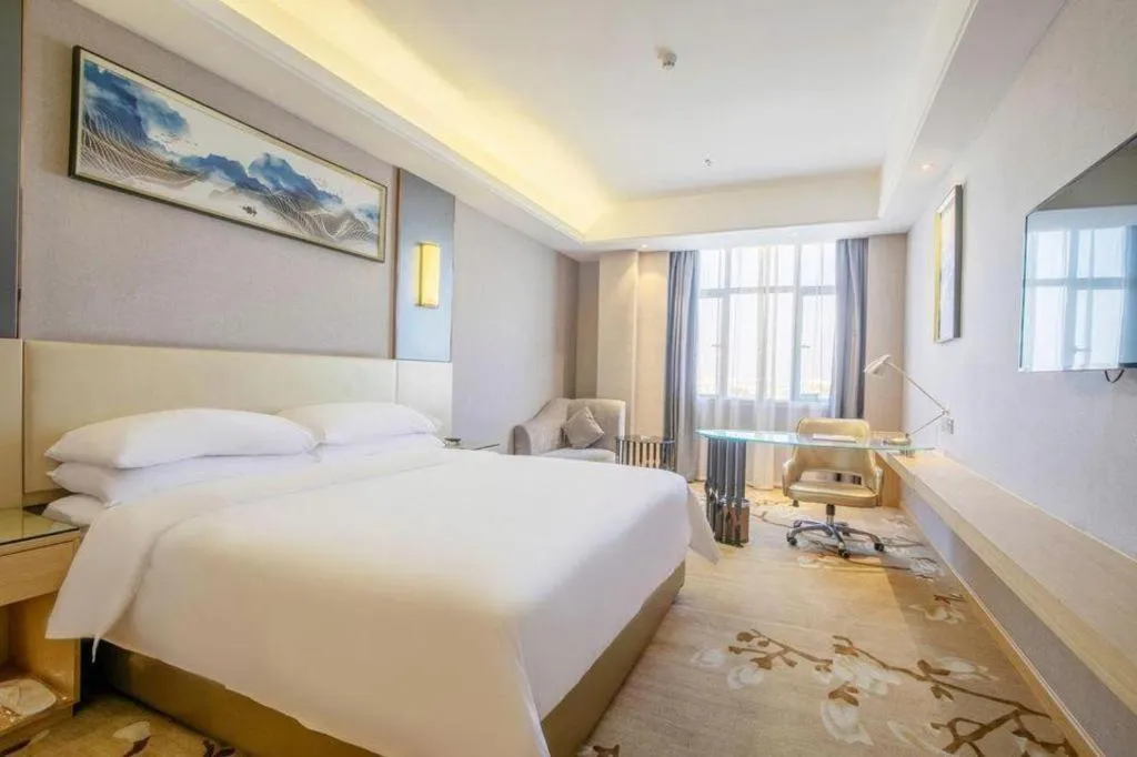 Bed in Vienna Hotel Guangdong Zhongshan Xiaolan High-Speed Railway Station