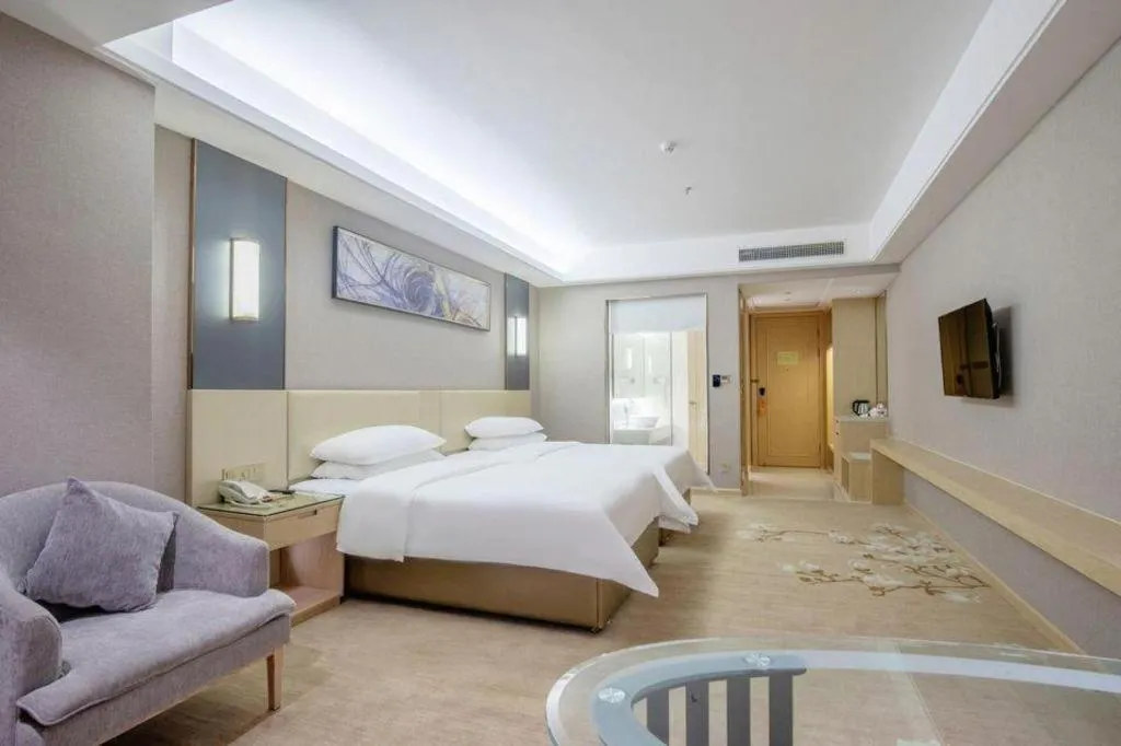 Bed in Vienna Hotel Guangdong Zhongshan Xiaolan High-Speed Railway Station
