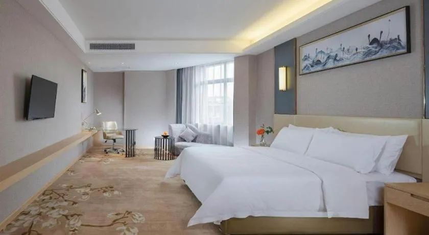 Bed in Vienna Hotel Guangdong Zhongshan Xiaolan High-Speed Railway Station