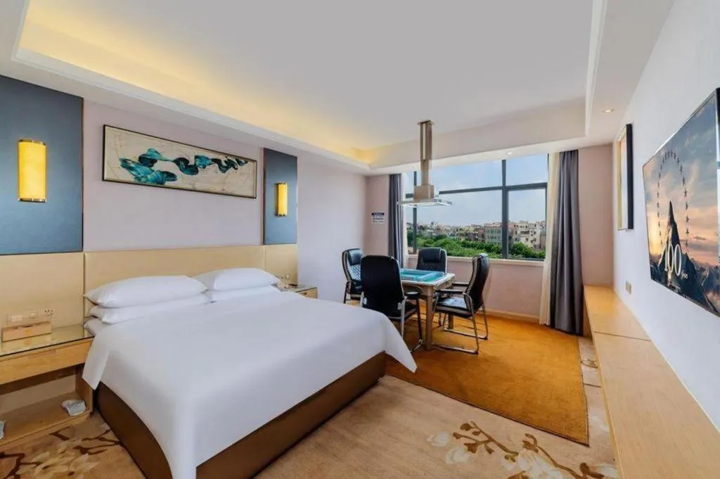 Bed in Vienna Hotel Guangdong Zhongshan Xiaolan High-Speed Railway Station