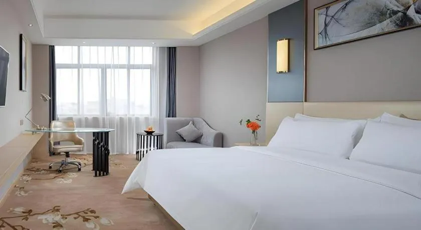 Bed in Vienna Hotel Guangdong Zhongshan Xiaolan High-Speed Railway Station