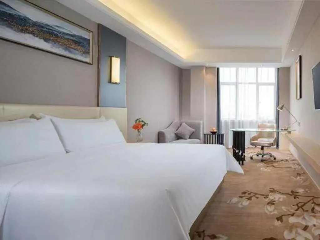 Bed in Vienna Hotel Guangdong Zhongshan Xiaolan High-Speed Railway Station