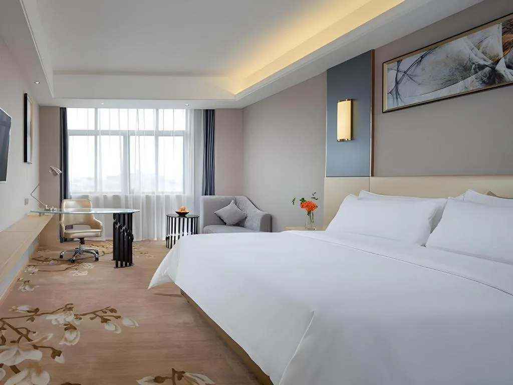 Bed in Vienna Hotel Guangdong Zhongshan Xiaolan High-Speed Railway Station
