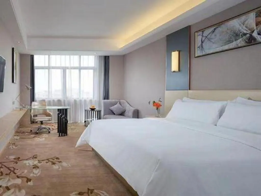 Bed in Vienna Hotel Guangdong Zhongshan Xiaolan High-Speed Railway Station