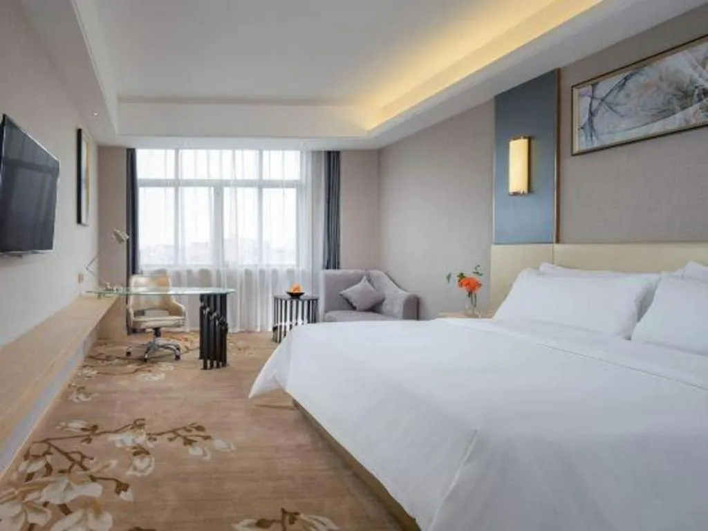 Bed in Vienna Hotel Guangdong Zhongshan Xiaolan High-Speed Railway Station