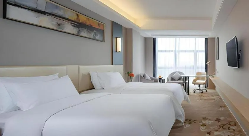 Bed in Vienna Hotel Guangdong Zhongshan Xiaolan High-Speed Railway Station
