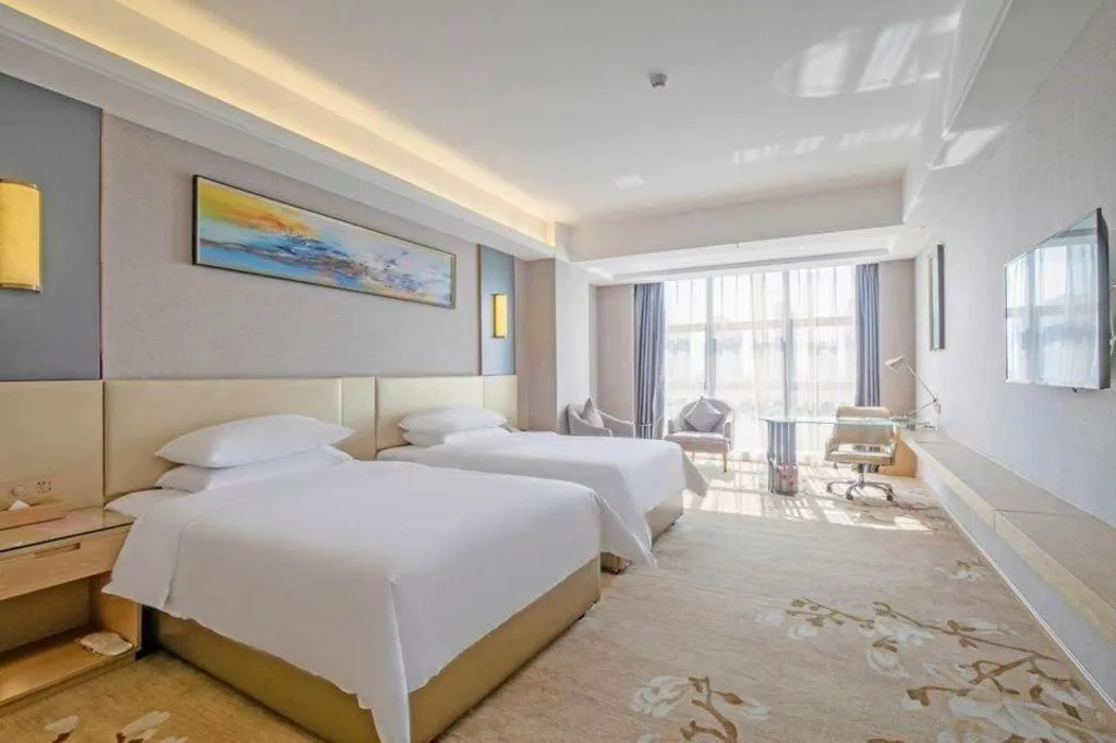 Bed in Vienna Hotel Guangdong Zhongshan Xiaolan High-Speed Railway Station