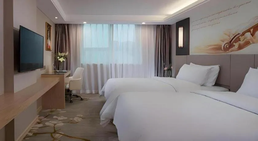 Bed in Venus International Hotel Guangdong Huizhou West Lake
