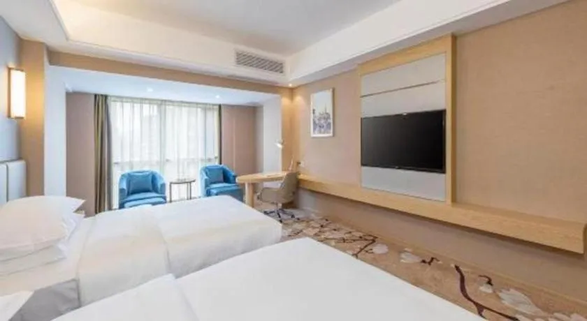 Bed in Vienna Hotel Fuzhou Changle Shouzhan Hangcheng Metro Station