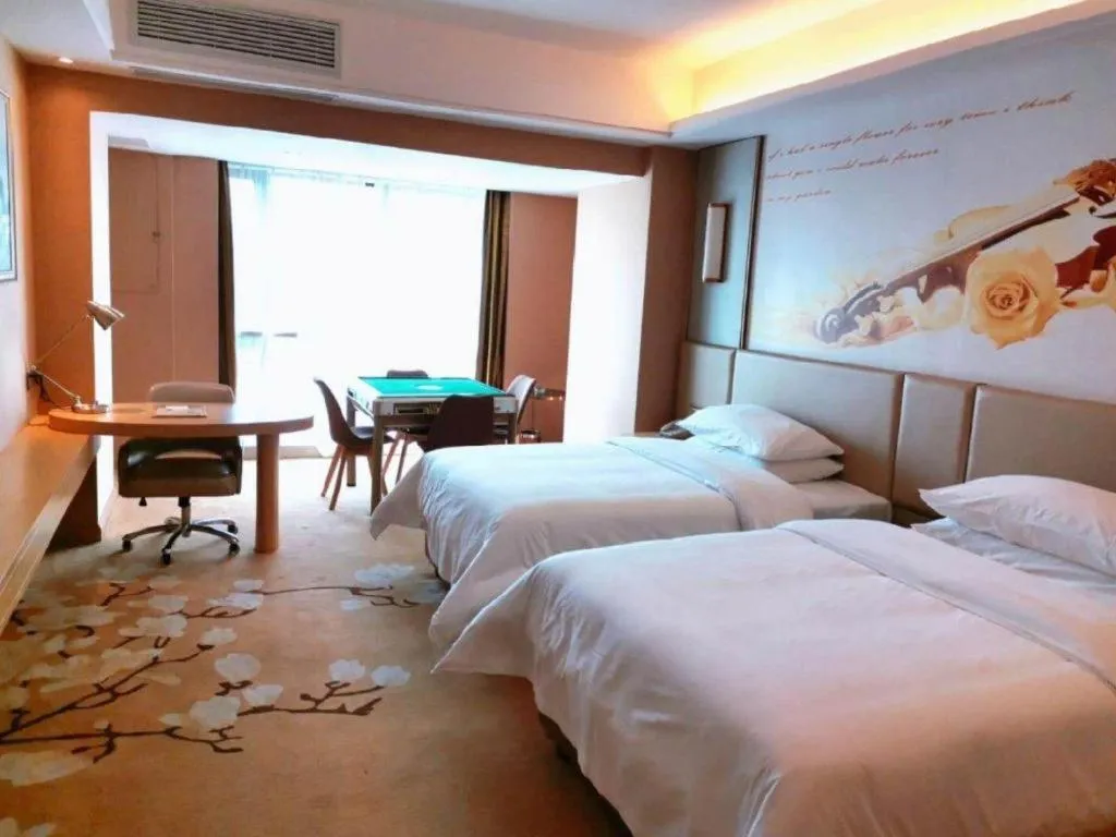 Bed in Vienna Hotel Fuzhou Changle Shouzhan Hangcheng Metro Station