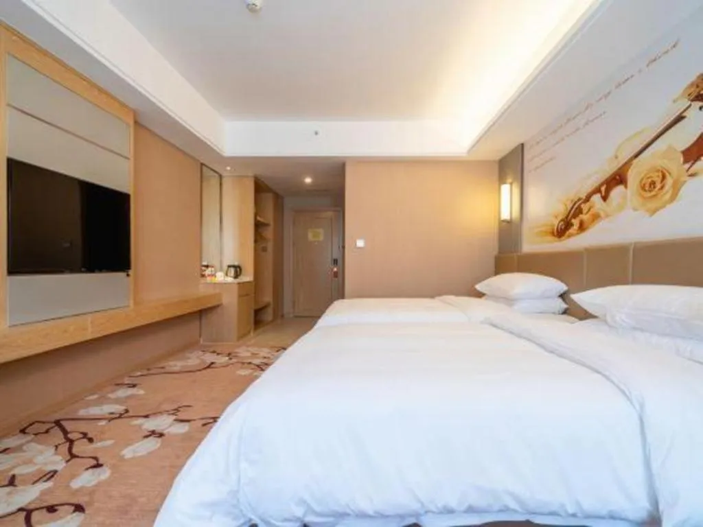 Bed in Vienna Hotel Fuzhou Changle Shouzhan Hangcheng Metro Station