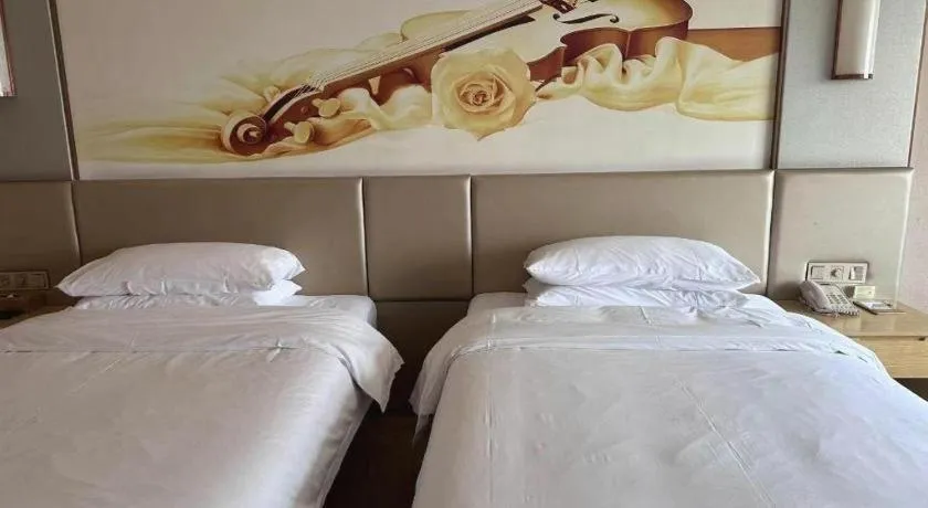 Bed in Vienna Hotel Fuzhou Changle Shouzhan Hangcheng Metro Station