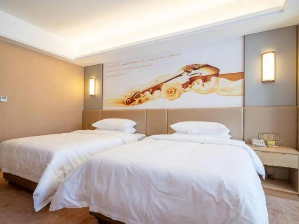Bed in Vienna Hotel Fuzhou Changle Shouzhan Hangcheng Metro Station