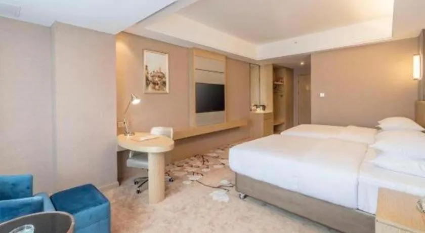 Bed in Vienna Hotel Fuzhou Changle Shouzhan Hangcheng Metro Station