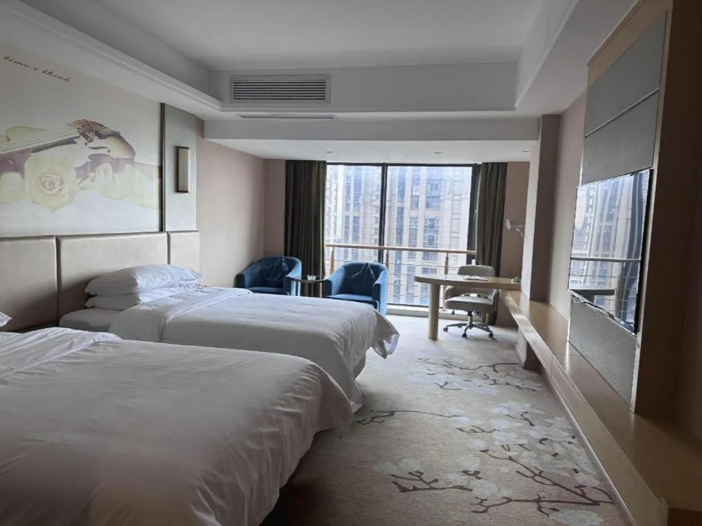 Bed in Vienna Hotel Fuzhou Changle Shouzhan Hangcheng Metro Station