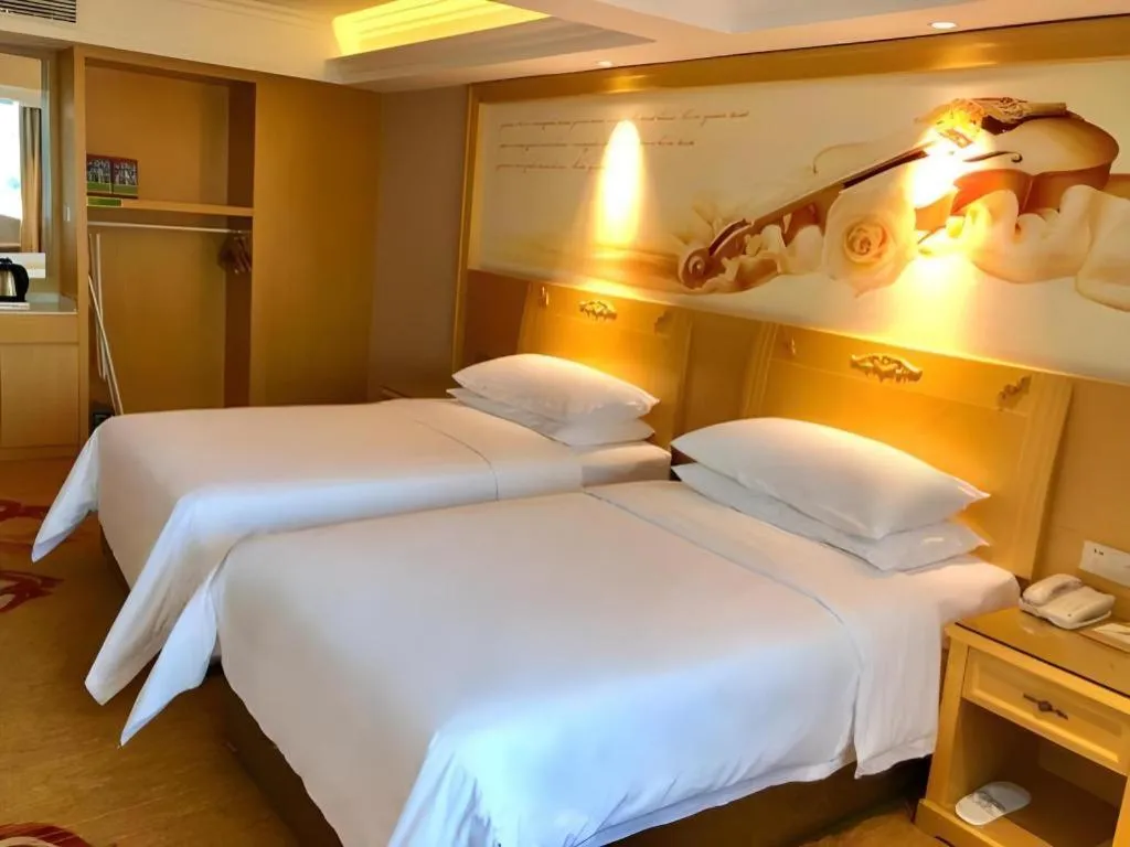 Bed in Vienna Hotel Guangxi Hezhou Guposhan Suifeng