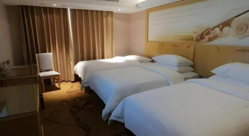 Bed in Vienna Hotel Guangxi Hezhou Guposhan Suifeng