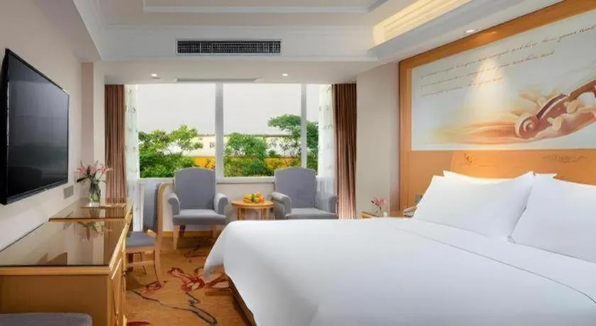 Bed in Vienna Hotel Guangxi Hezhou Guposhan Suifeng