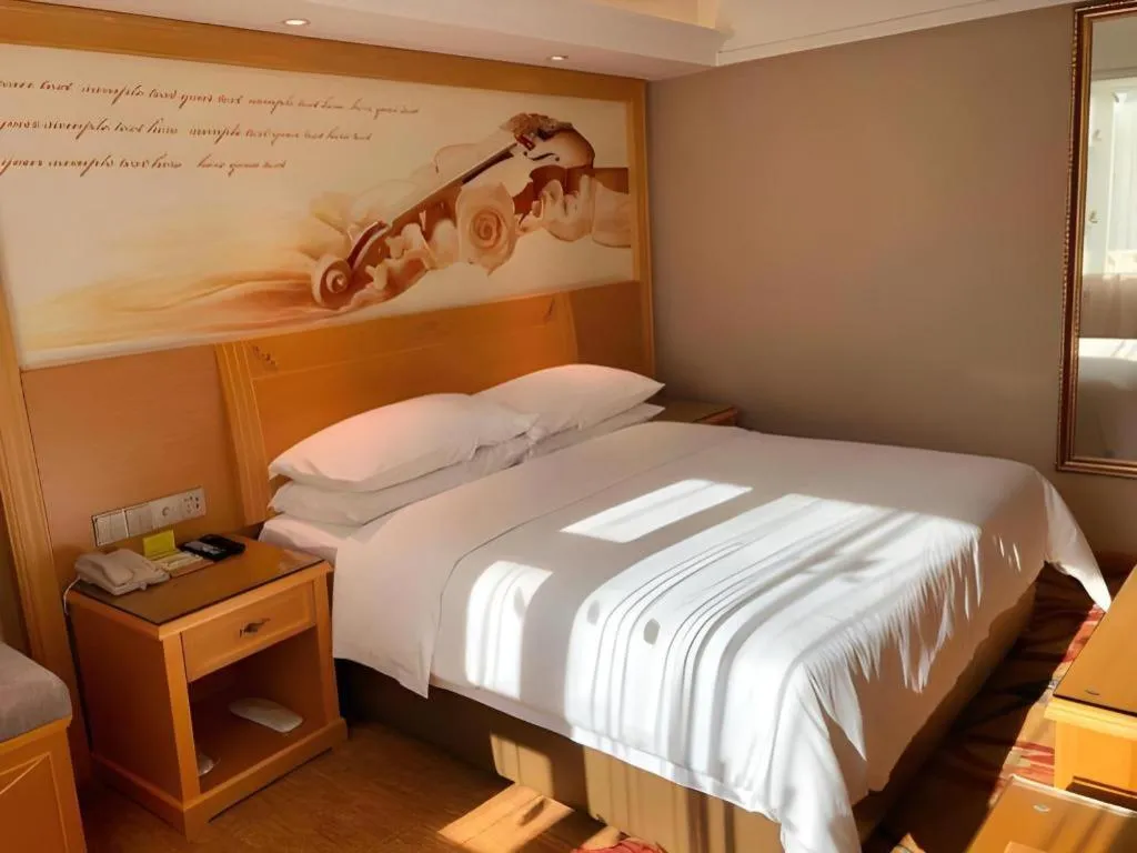 Bed in Vienna Hotel Guangxi Hezhou Guposhan Suifeng