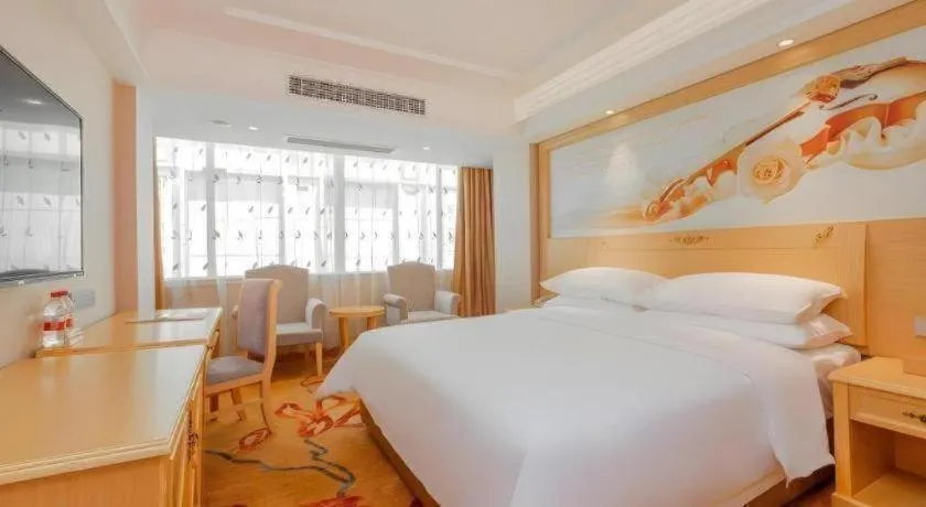 Bed in Vienna Hotel Guangxi Hezhou Guposhan Suifeng