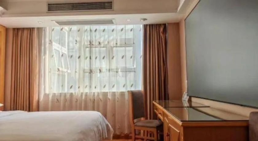 Bed in Vienna Hotel Guangxi Hezhou Guposhan Suifeng