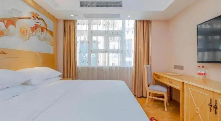 Bed in Vienna Hotel Guangxi Hezhou Guposhan Suifeng