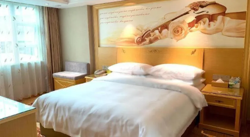 Bed in Vienna Hotel Guangxi Hezhou Guposhan Suifeng