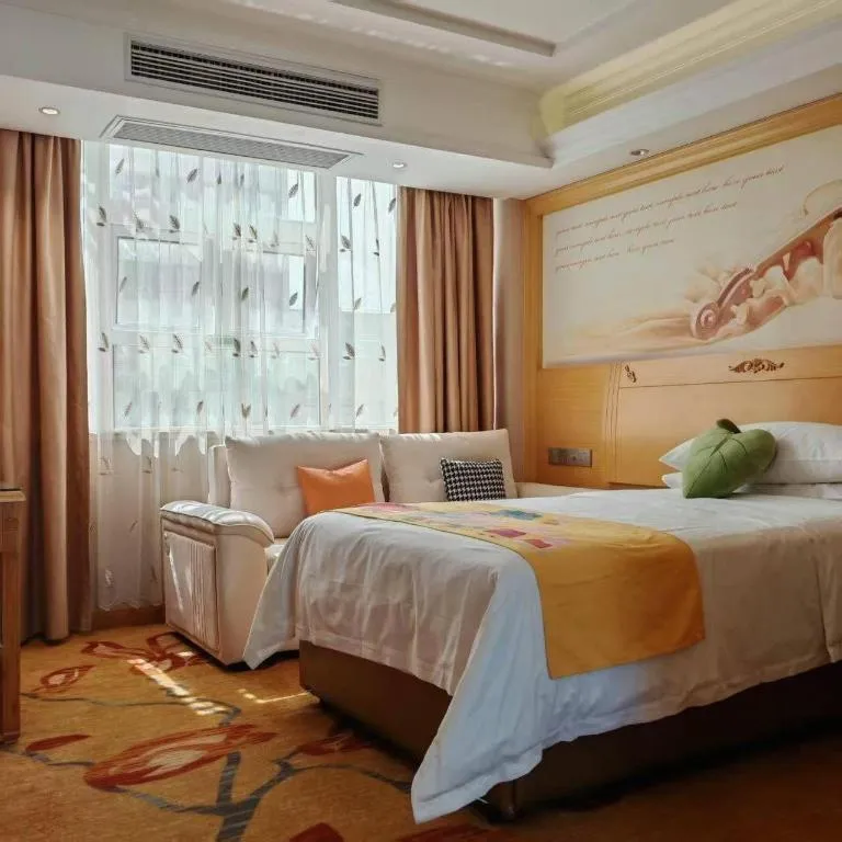 Bed in Vienna Hotel Guangxi Hezhou Guposhan Suifeng