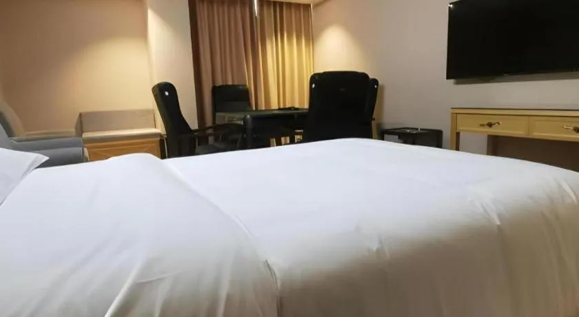 Bed in Vienna Hotel Guangxi Hezhou Guposhan Suifeng