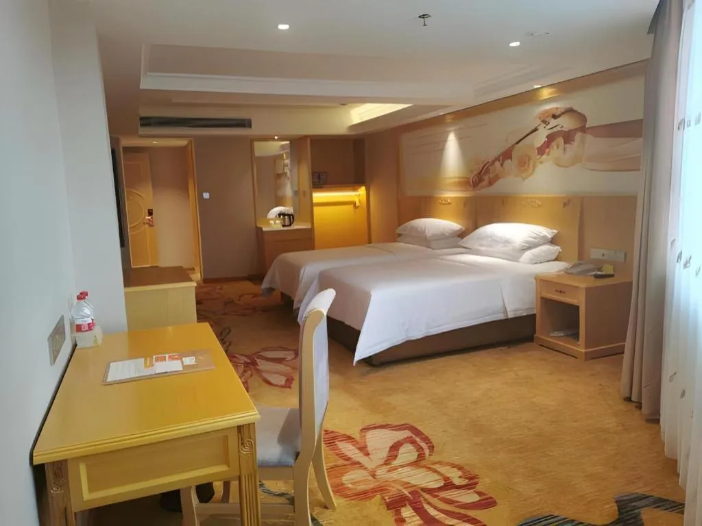 Bed in Vienna Hotel Guangxi Hezhou Guposhan Suifeng