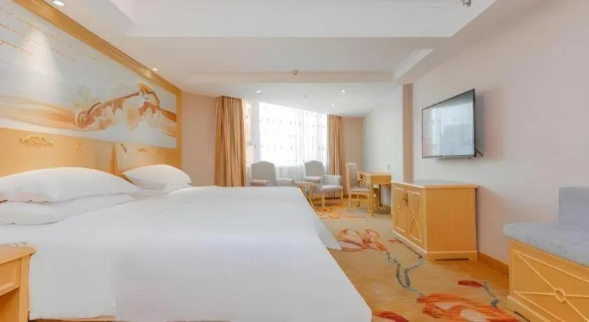 Bed in Vienna Hotel Guangxi Hezhou Guposhan Suifeng