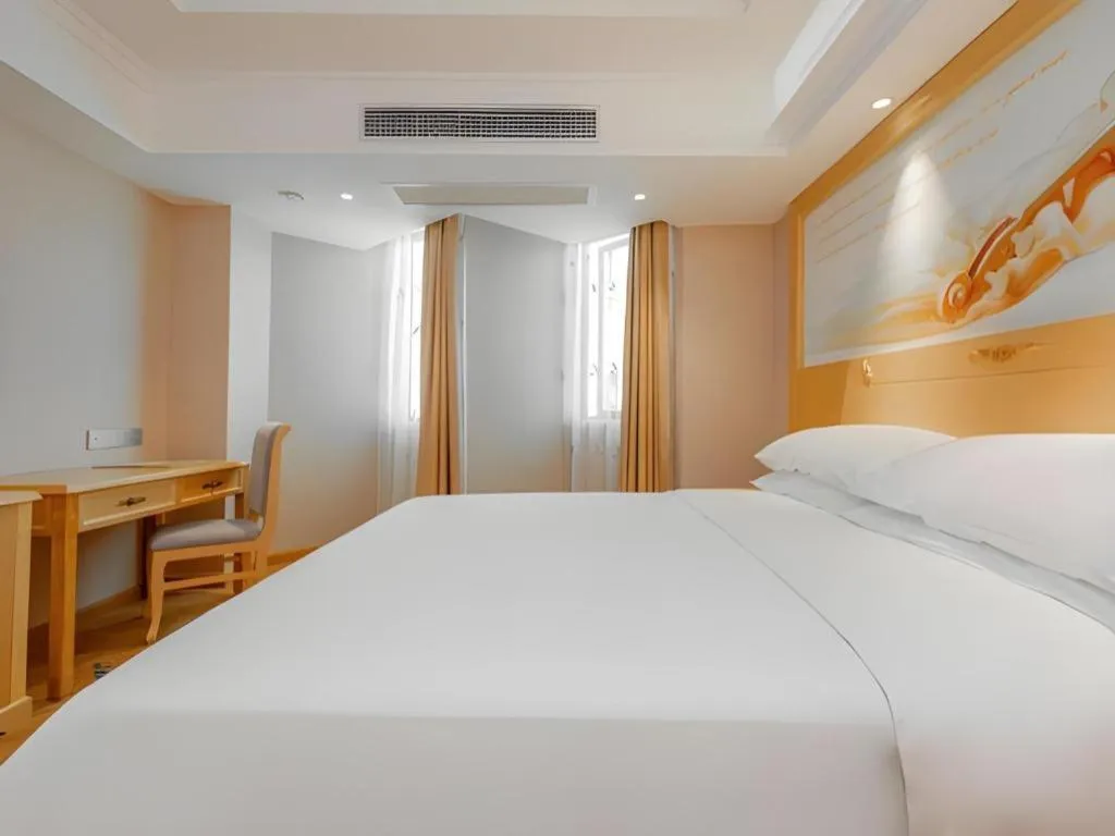 Bed in Vienna Hotel Guangxi Hezhou Guposhan Suifeng
