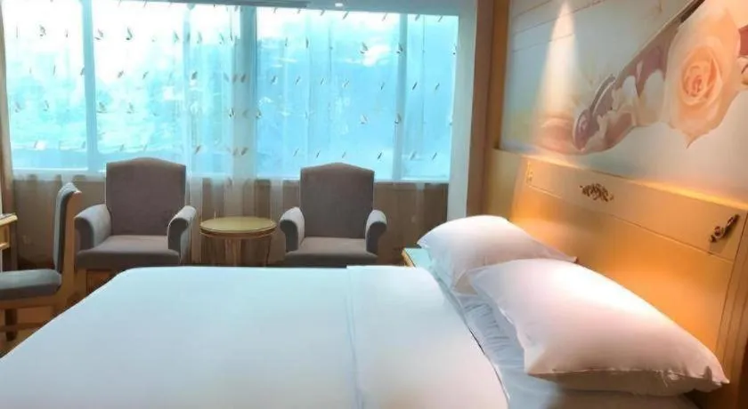 Bed in Vienna Hotel Guangxi Hezhou Guposhan Suifeng