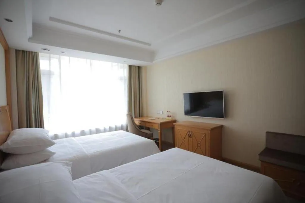 Bed in Vienna Hotel Shenyang Central Street