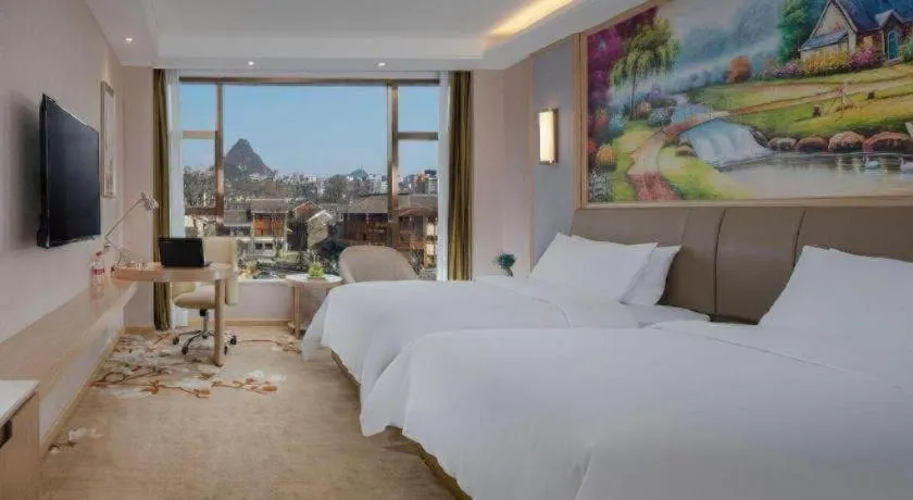 Bed in Vienna Hotel Guizhou Liupanshui Shuicheng Ancient Town