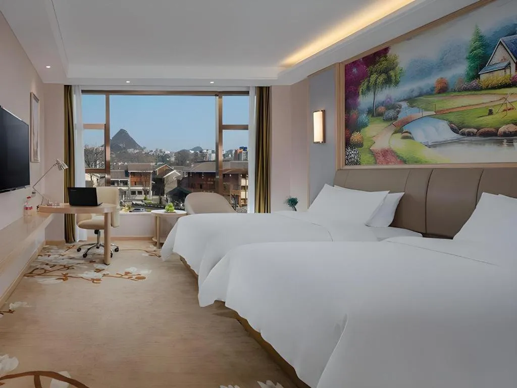 Bed in Vienna Hotel Guizhou Liupanshui Shuicheng Ancient Town