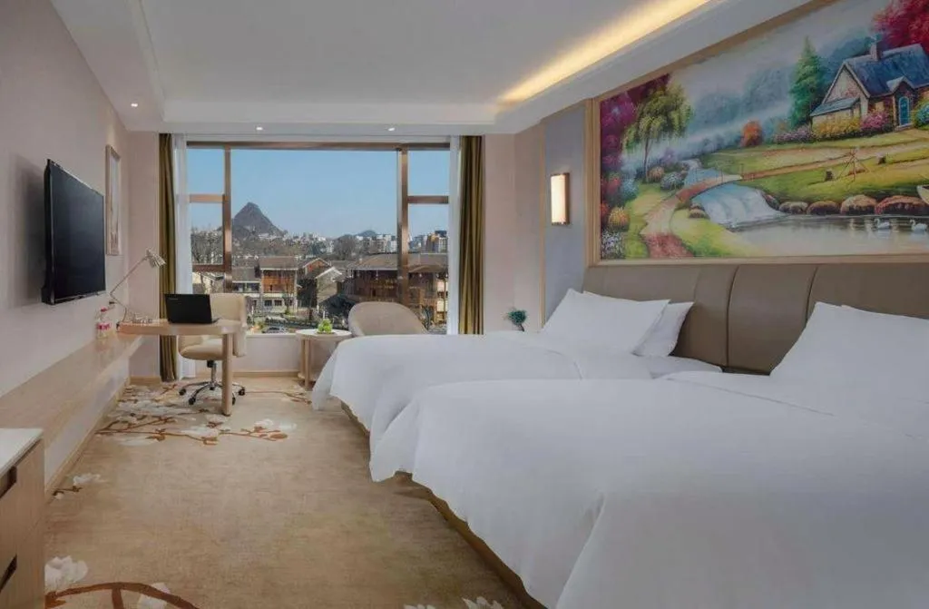 Bed in Vienna Hotel Guizhou Liupanshui Shuicheng Ancient Town